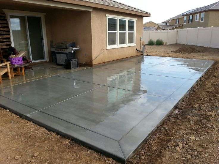 Broom finish concrete patio slab with 12 border bands ...