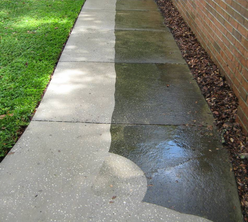 Cleaning a concrete walkway  Dailey Maintenance LLC