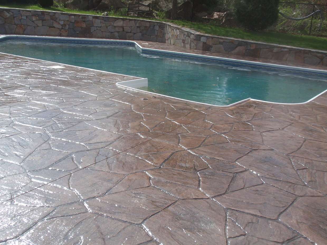 Colored pavers or stamped concrete patio look better in ...