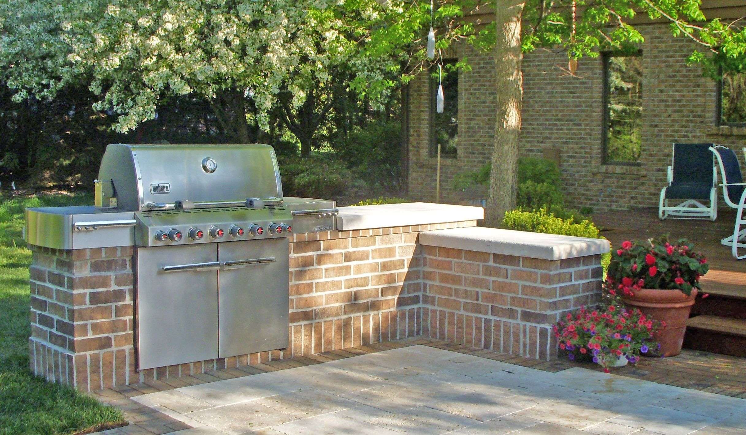 Gas grill built into mortared brick surround with Waukesha ...