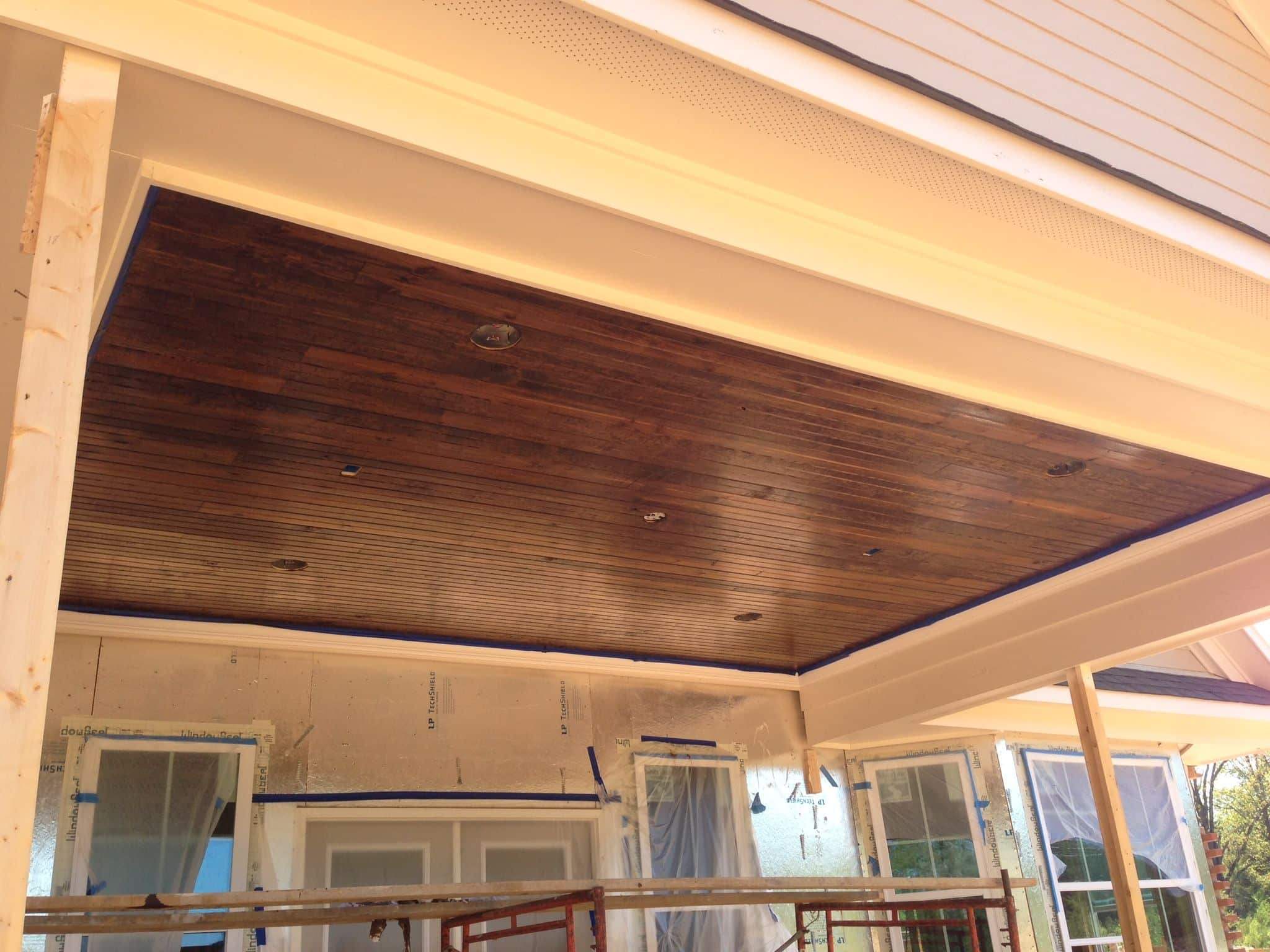 Our patio ceiling! Tongue / groove wood with a dark stain. Love it ...