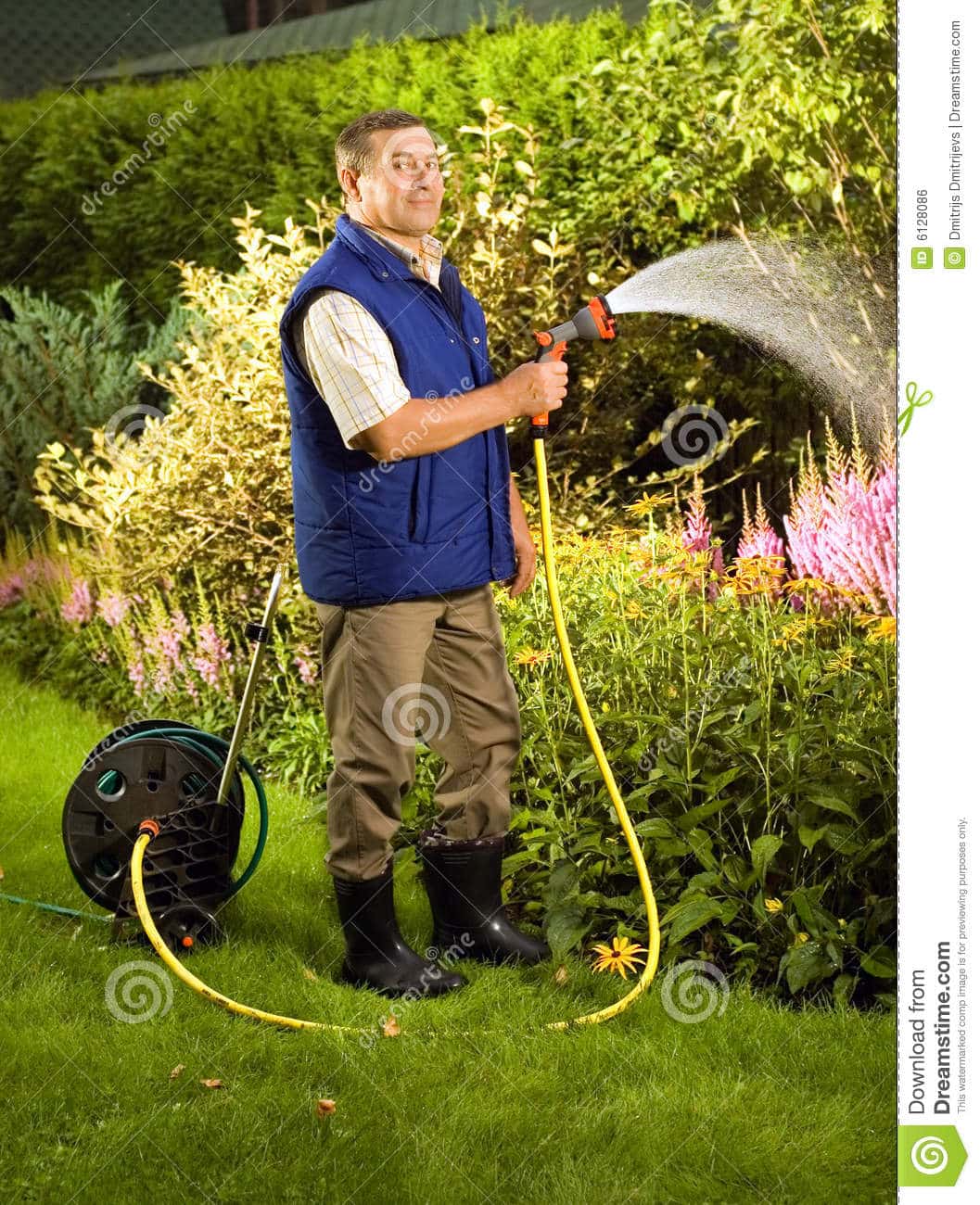 Senior Man Watering Flowers In The Garden Royalty Free Stock Image ...